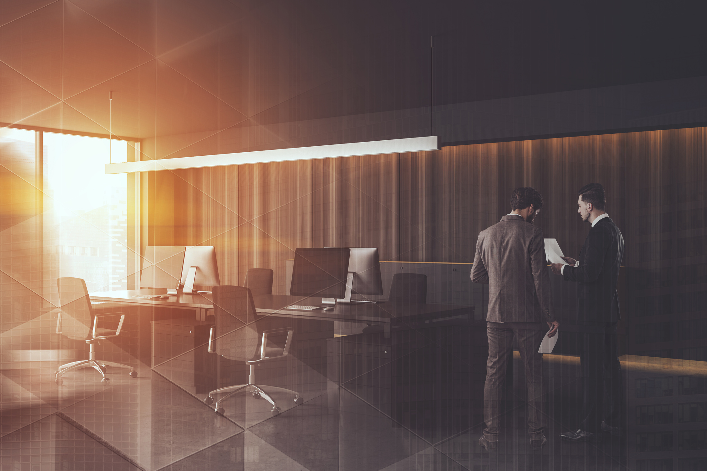 Businessmen in dark wooden office